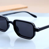 Polygonal sun glasses with curved bridge in black