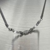 Spring coil charmed necklace